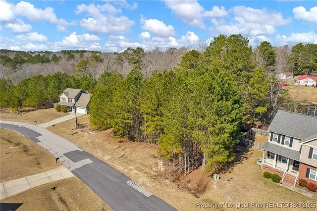 a view of a patio with a table and chairs