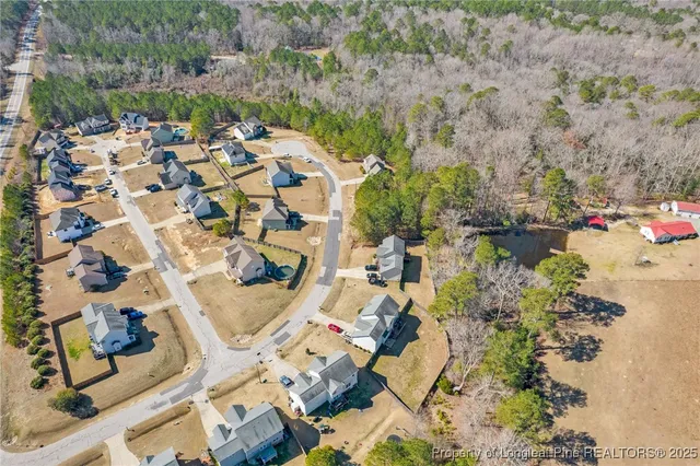 a view of swimming pool with sitting area