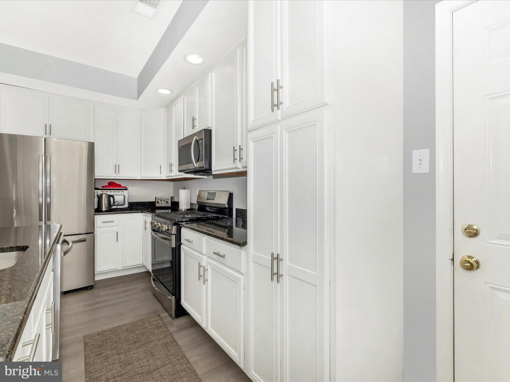 1813 Wheyfield Drive, Unit 10A Frederick, MD 21701 - Photo 13 of 50 a kitchen with cabinets and stainless steel appliances