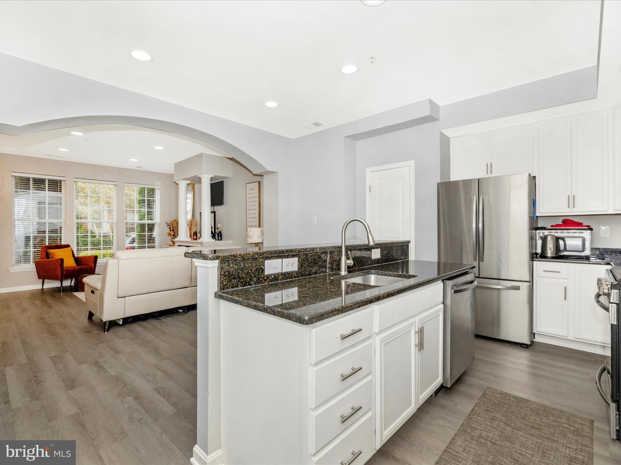 1813 Wheyfield Drive, Unit 10A Frederick, MD 21701 - Photo 14 of 50 a kitchen with stainless steel appliances granite countertop a refrigerator a stove and a sink