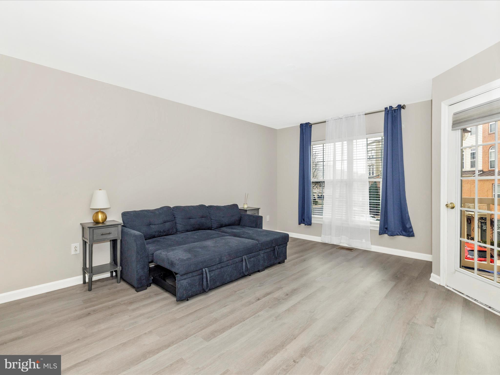 1813 Wheyfield Drive, Unit 10A Frederick, MD 21701 - Photo 17 of 50 a living room with furniture and a window