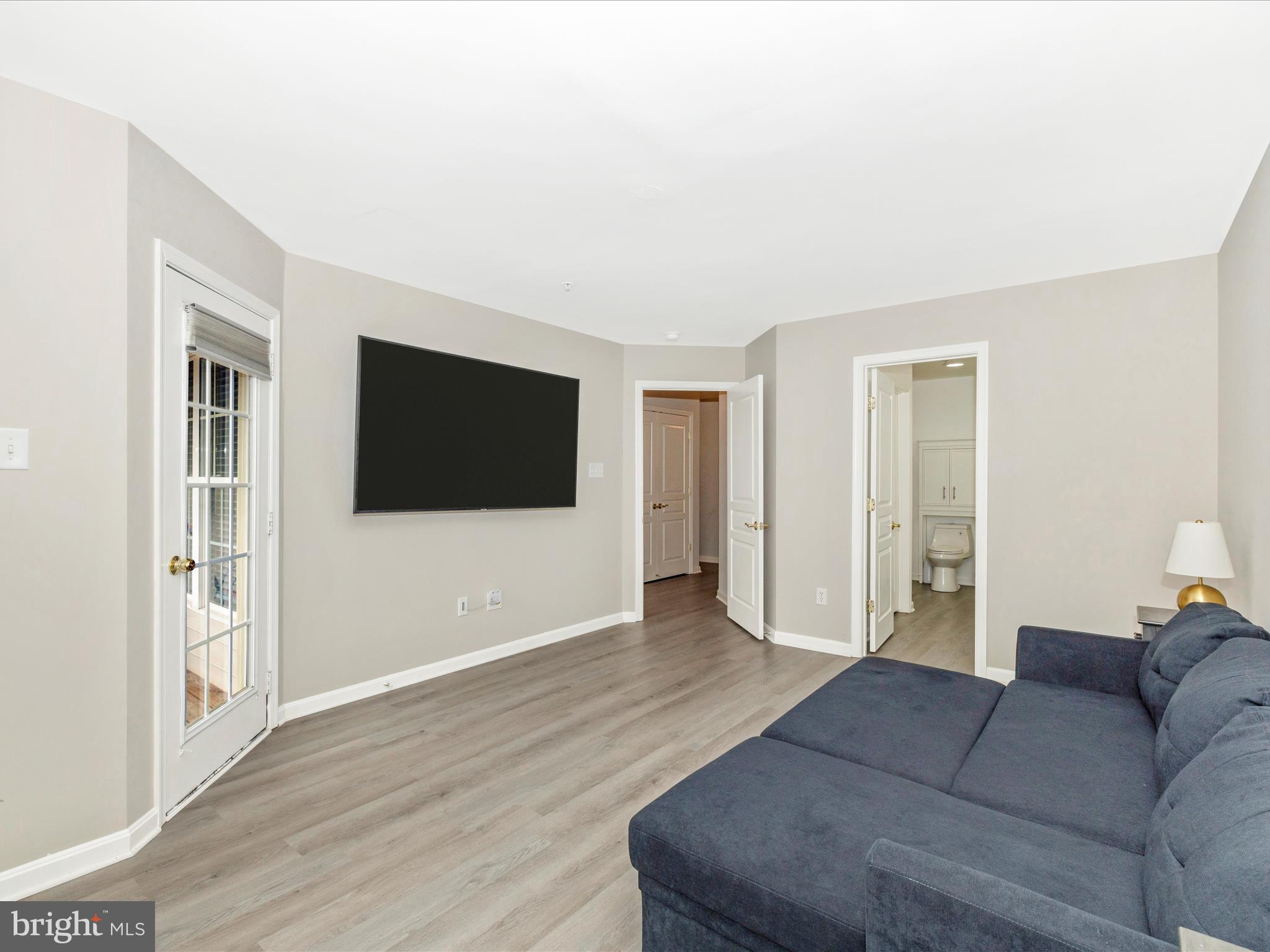 1813 Wheyfield Drive, Unit 10A Frederick, MD 21701 - Photo 19 of 50 a living room with furniture and a flat screen tv