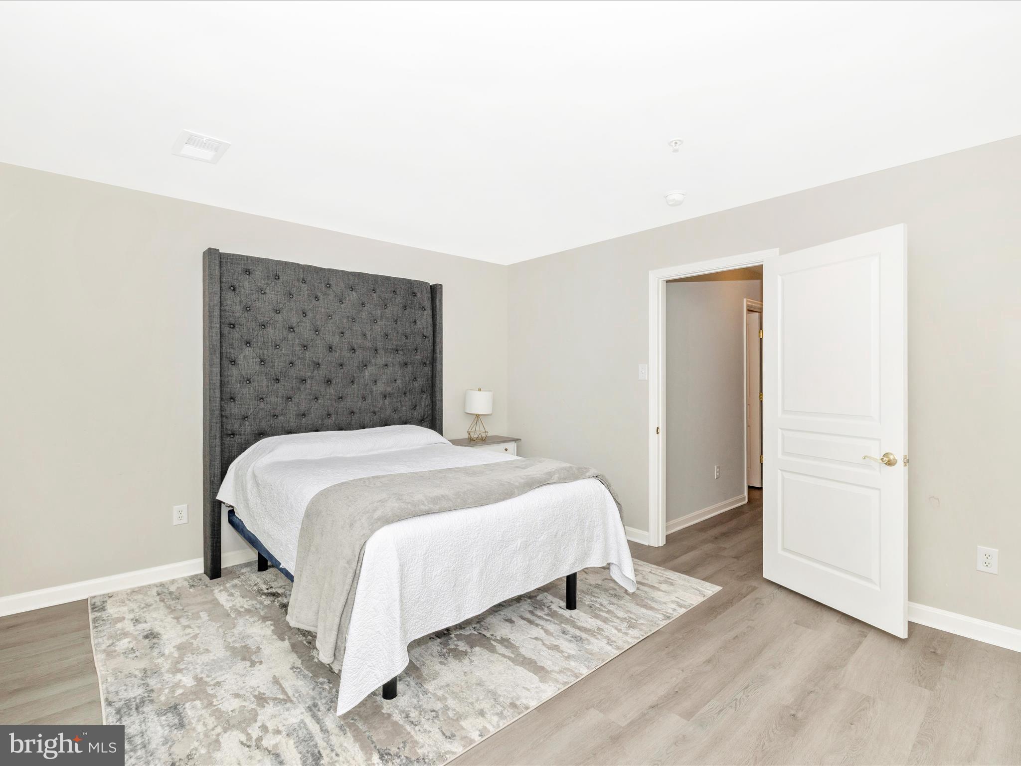 1813 Wheyfield Drive, Unit 10A Frederick, MD 21701 - Photo 27 of 50 a bedroom with a bed and a window