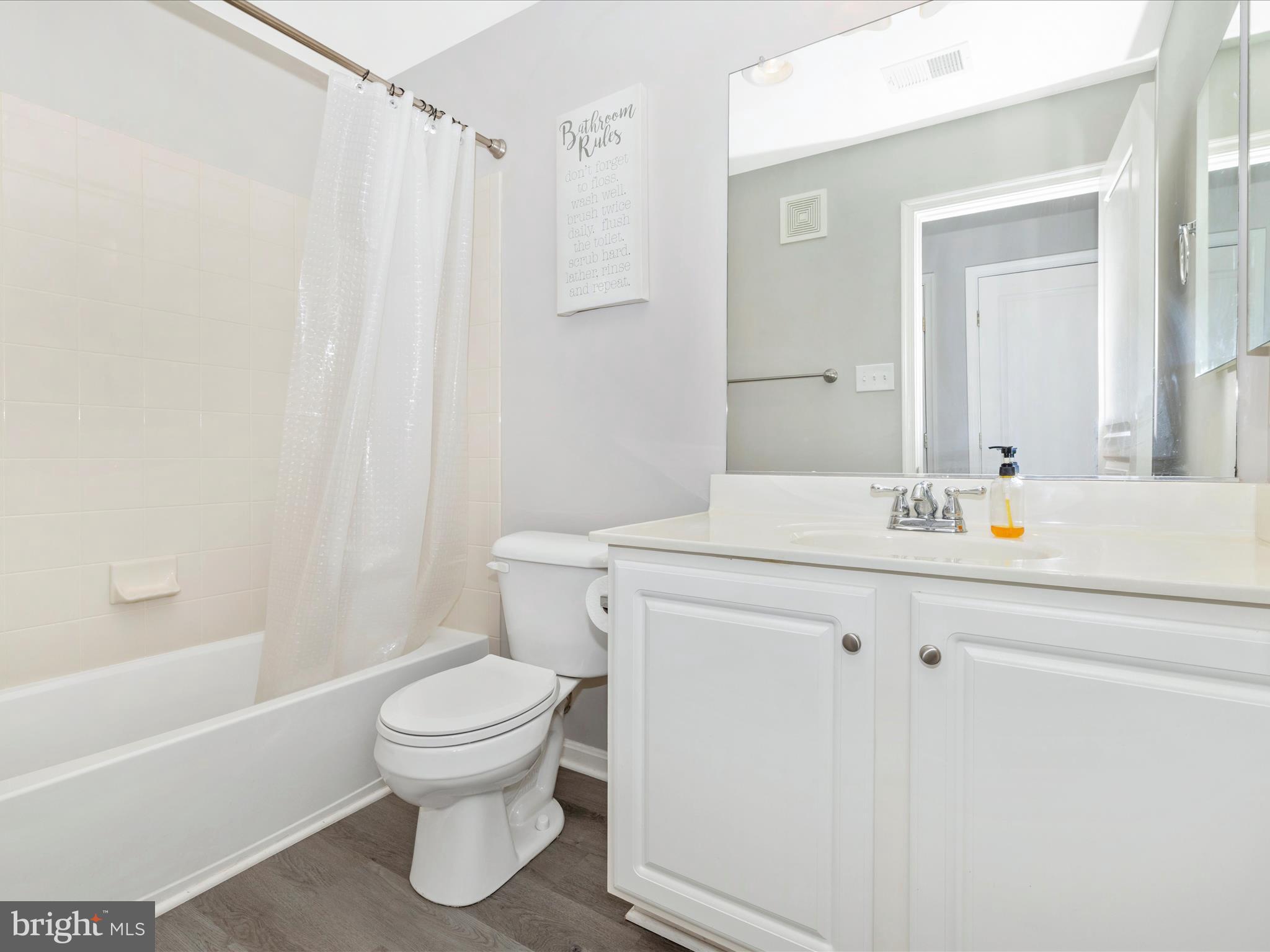 1813 Wheyfield Drive, Unit 10A Frederick, MD 21701 - Photo 30 of 50 a bathroom with a sink a toilet and a bathtub