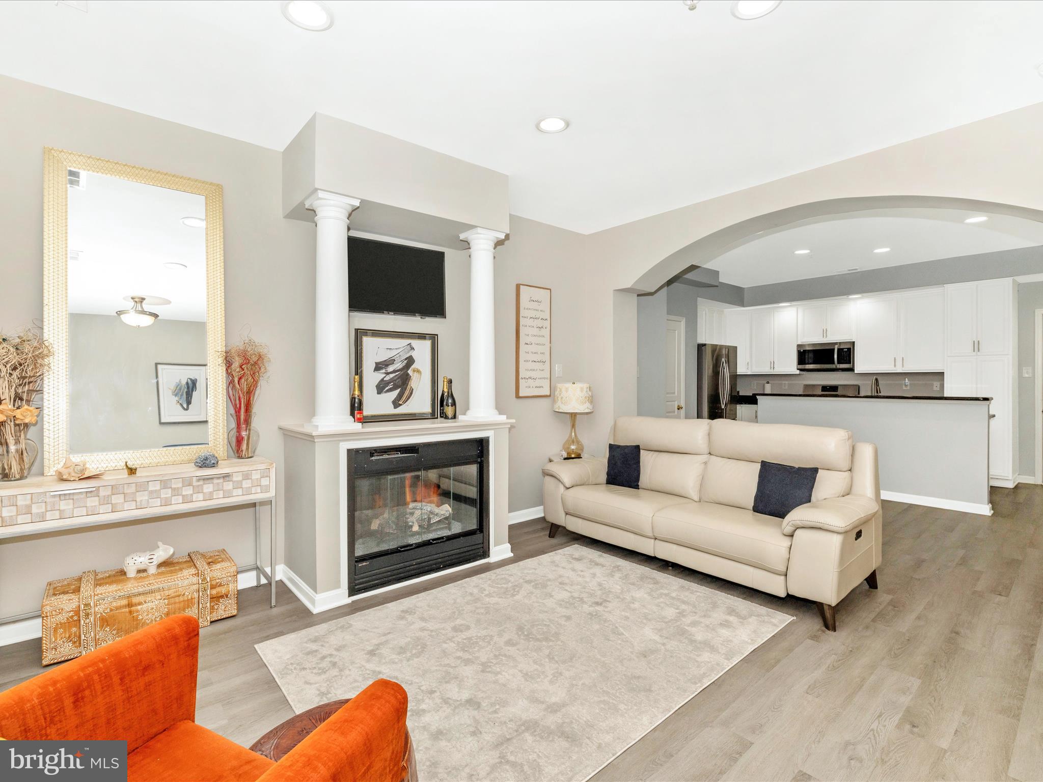 1813 Wheyfield Drive, Unit 10A Frederick, MD 21701 - Photo 8 of 50 a living room with furniture flat screen tv and a fireplace