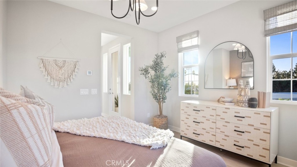 1074 North Anaheim Boulevard, Unit 2 Anaheim, CA 92801 - Photo 11 of 21 a bedroom with a bed and a dresser