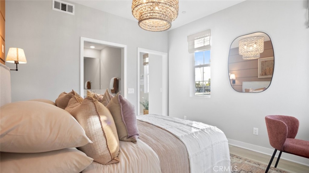 1074 North Anaheim Boulevard, Unit 2 Anaheim, CA 92801 - Photo 16 of 21 a bedroom with bed and a chair