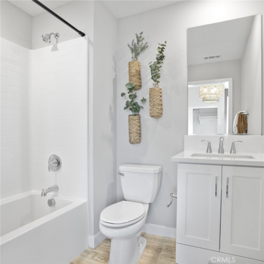 1074 North Anaheim Boulevard, Unit 2 Anaheim, CA 92801 - Photo 17 of 21 a bathroom with a sink toilet and shower