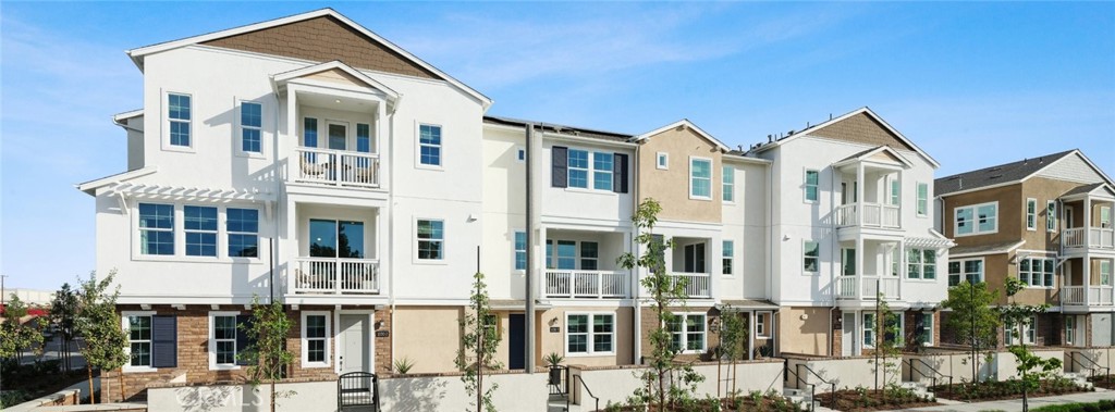 1074 North Anaheim Boulevard, Unit 2 Anaheim, CA 92801 - Photo 21 of 21 a front view of a residential apartment building with a yard