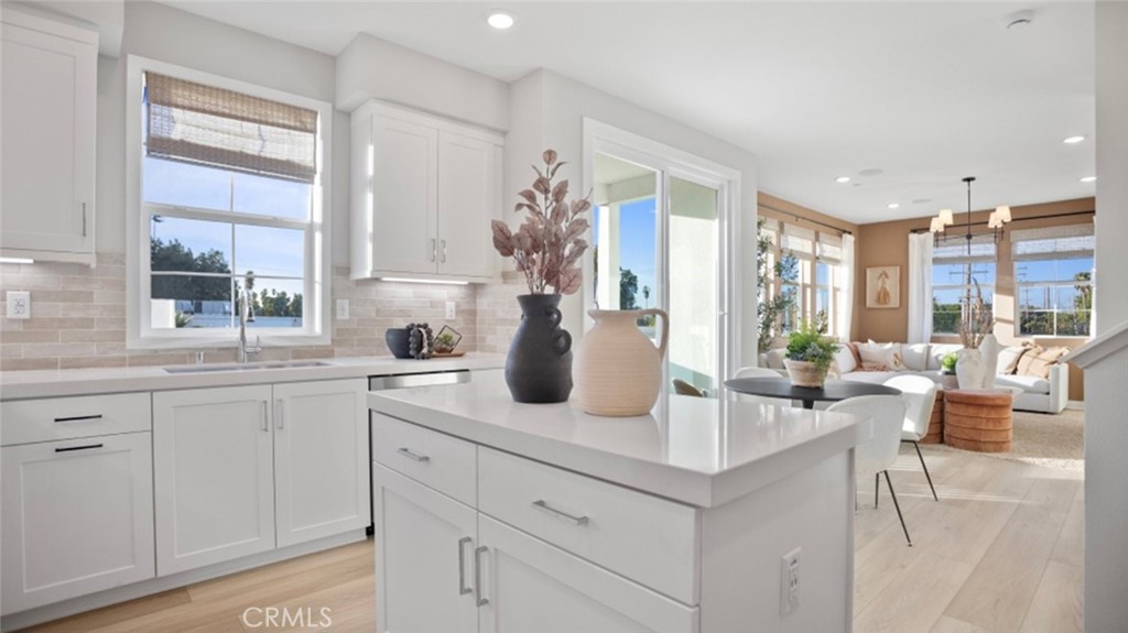 1074 North Anaheim Boulevard, Unit 2 Anaheim, CA 92801 - Photo 4 of 21 a kitchen with sink cabinets and living room