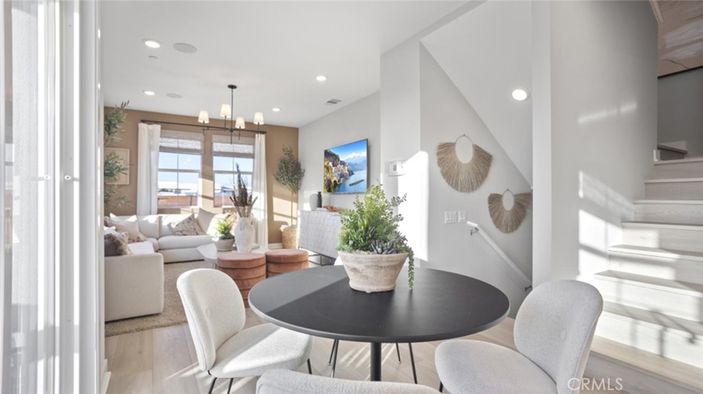 1074 North Anaheim Boulevard, Unit 2 Anaheim, CA 92801 - Photo 6 of 21 a dining room with furniture and wooden floor