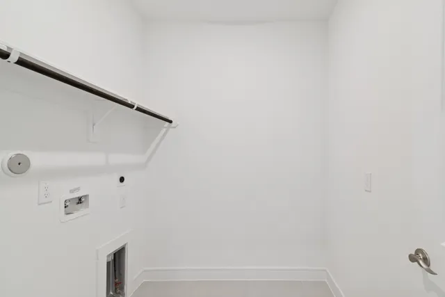 a view of green field with house in the background