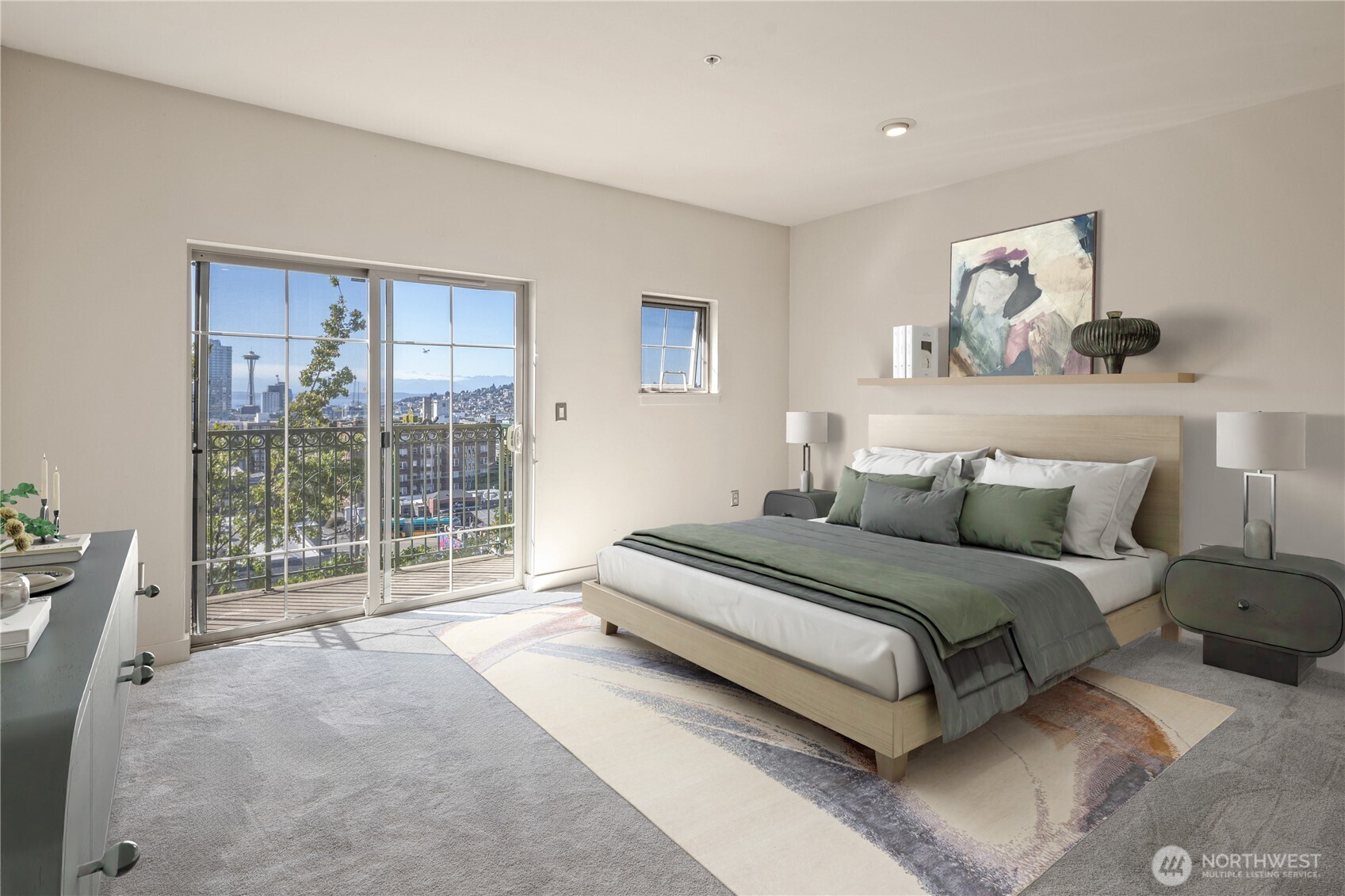 700 East Denny Way, Unit 603 Seattle, WA 98122 - Photo 16 of 37 a spacious bedroom with a bed and glass window