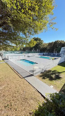 a couple of cars parked in front of a building