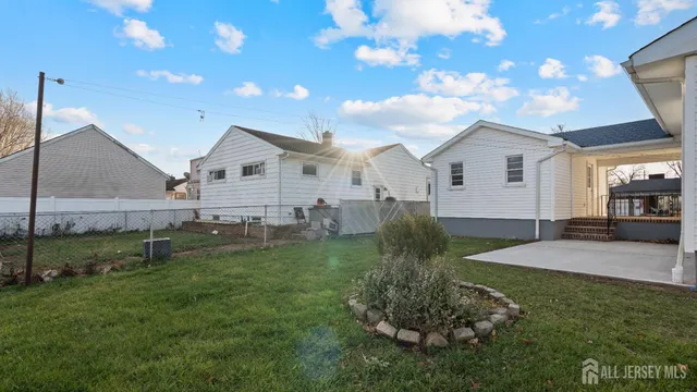 a view of a backyard of the house