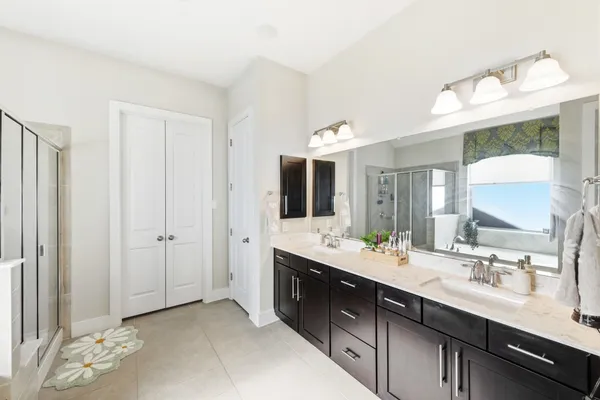 a bathroom with a bathtub and a shower