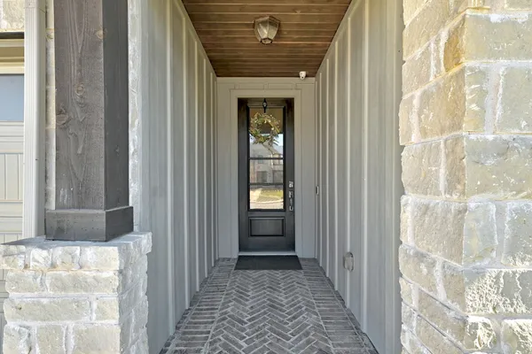 a view of a hallway with windows
