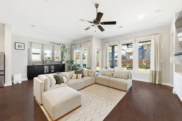 a living room with furniture and a large window