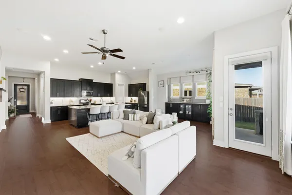 a view of a kitchen and living room with furniture