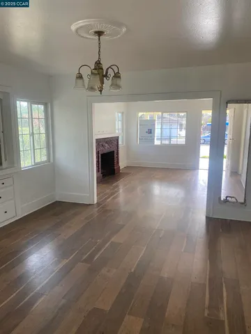a view of livingroom with hardwood floor and window