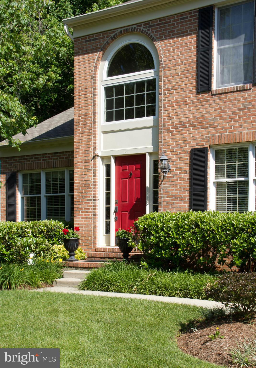 1406 Hunting Wood Road Annapolis, MD 21403 - Photo 2 of 23 a front view of a house with garden