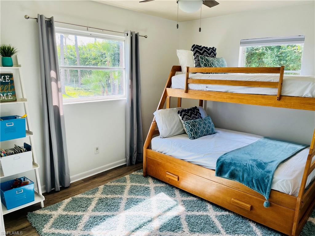 6730 Sable Ridge Lane Naples, FL 34109 - Photo 16 of 27 a bedroom with a bed and a window