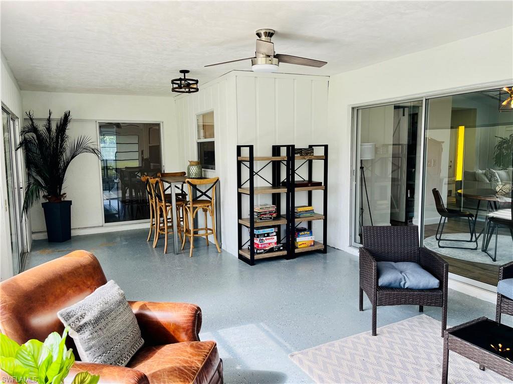 6730 Sable Ridge Lane Naples, FL 34109 - Photo 20 of 27 a living room with furniture and a couch