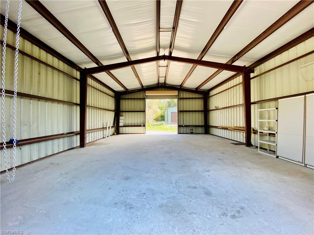 6730 Sable Ridge Lane Naples, FL 34109 - Photo 24 of 27 a view of an empty room with a window