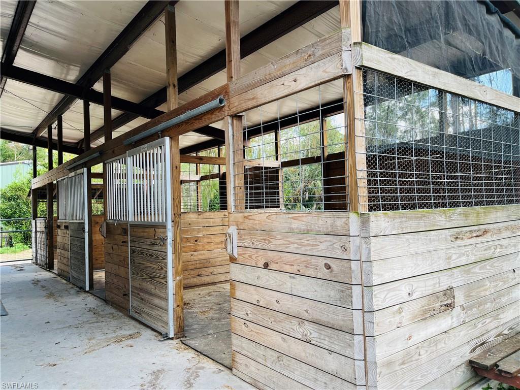 6730 Sable Ridge Lane Naples, FL 34109 - Photo 25 of 27 a view of entrance gate of a building