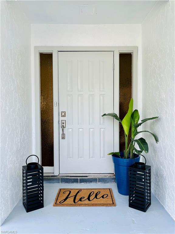 6730 Sable Ridge Lane Naples, FL 34109 - Photo 3 of 27 a view of table with potted plant