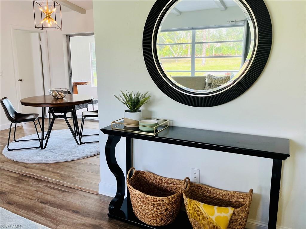 6730 Sable Ridge Lane Naples, FL 34109 - Photo 4 of 27 a view of a livingroom with furniture and a mirror