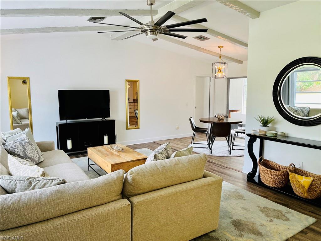 6730 Sable Ridge Lane Naples, FL 34109 - Photo 6 of 27 a living room with furniture and a flat screen tv