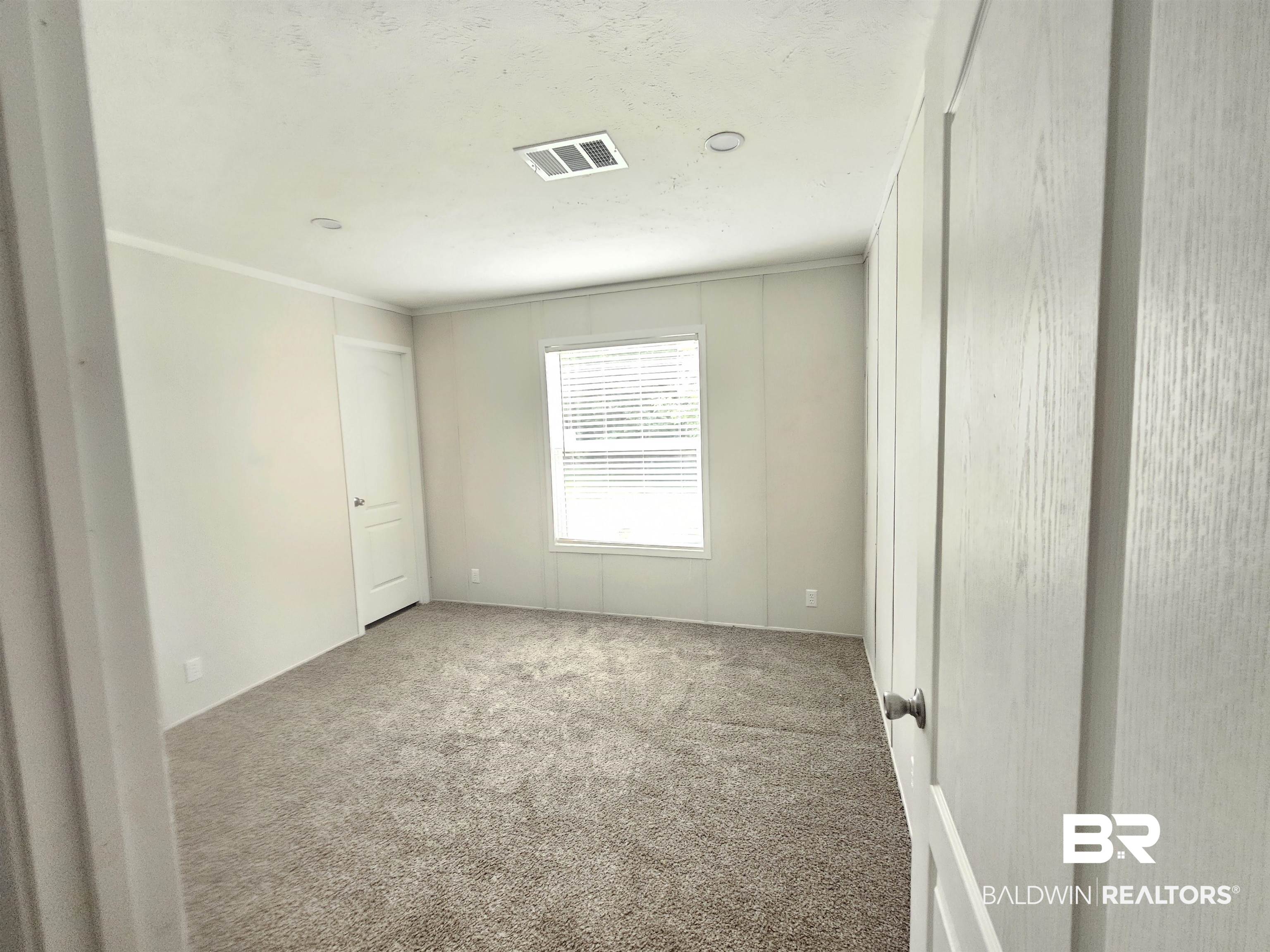 1863 Wait Road Monroeville, AL 36460 - Photo 22 of 38 Unfurnished room featuring carpet floors