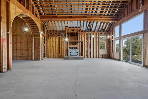 a view of an empty room with windows