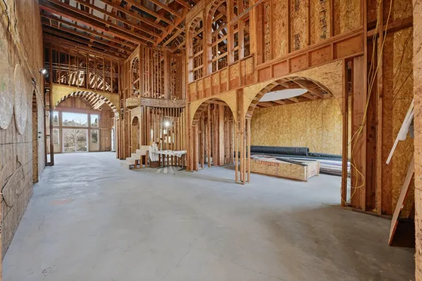 a view of an empty room with floor to ceiling window