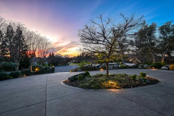 a view of a house with a sink and yard