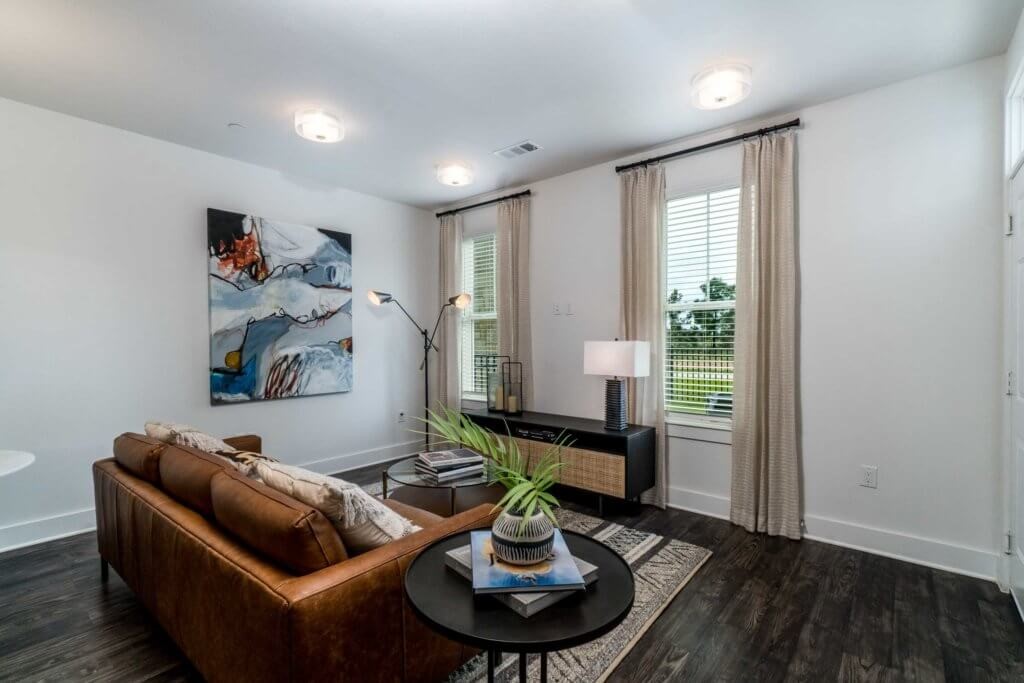 11250 Mason Road, Unit 4125 Cypress, TX 77433 - Photo 1 of 13 a living room with furniture and a wooden floor