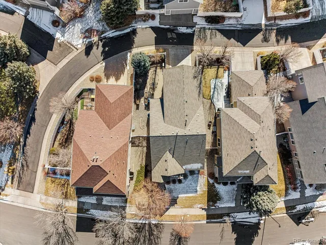 an aerial view of houses with outdoor space