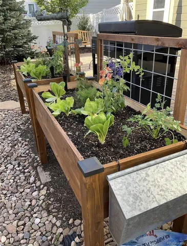 a view of a patio with table and chairs and wooden floor