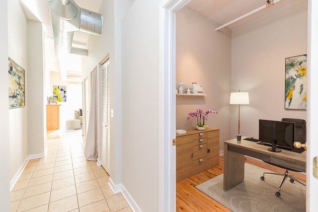 910 West Madison Street, Unit 703 Chicago, IL 60607 - Photo 8 of 23 a view of a workspace with furniture and a window
