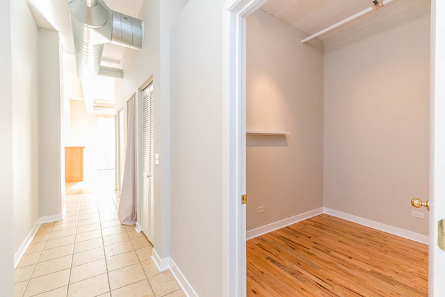 910 West Madison Street, Unit 703 Chicago, IL 60607 - Photo 9 of 23 a view of a bedroom & wooden floor
