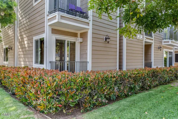 front view of a house with a garden
