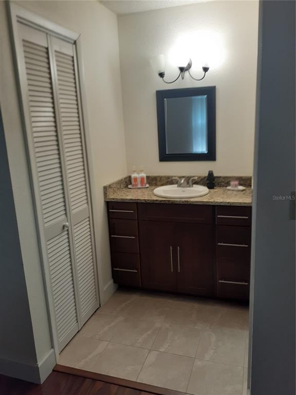 455 Alt 19, Unit 16 Palm Harbor, FL 34683 - Photo 11 of 25 a bathroom with a sink and a mirror