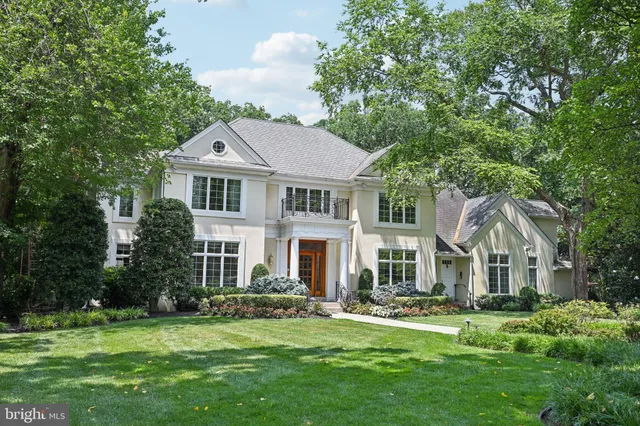a front view of a house with a garden and porch