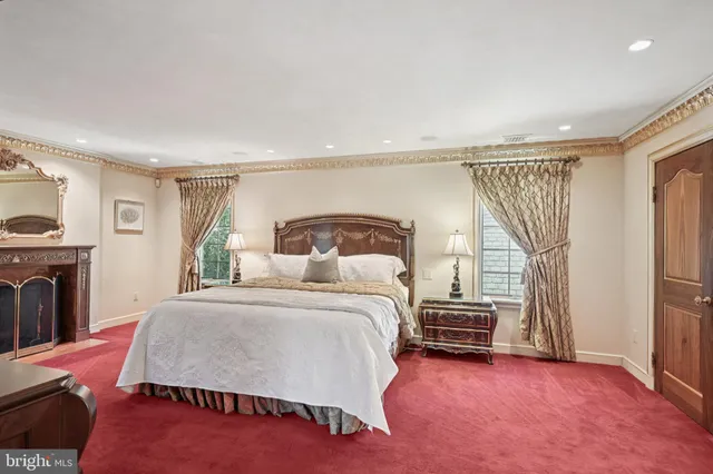 a bedroom with a bed and a potted plant