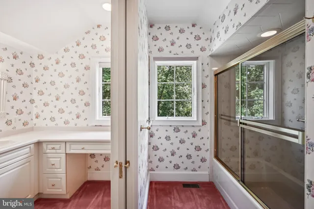 a bathroom with a shower and a toilet