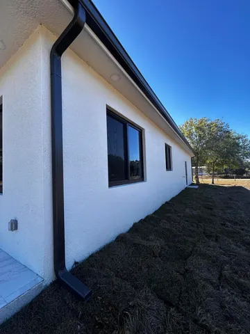 a view of swimming pool with seating space