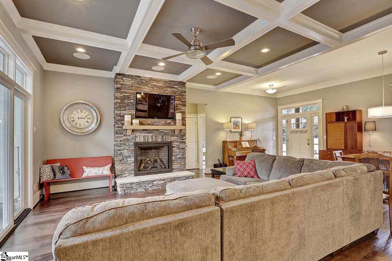 815 Batesville Road Greer, SC 29651 - Photo 3 of 35 Stone fireplace and coffered ceiling.
