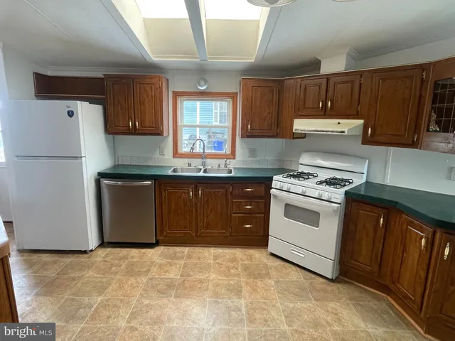 a kitchen with a sink and a stove