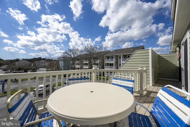 a view of balcony with furniture